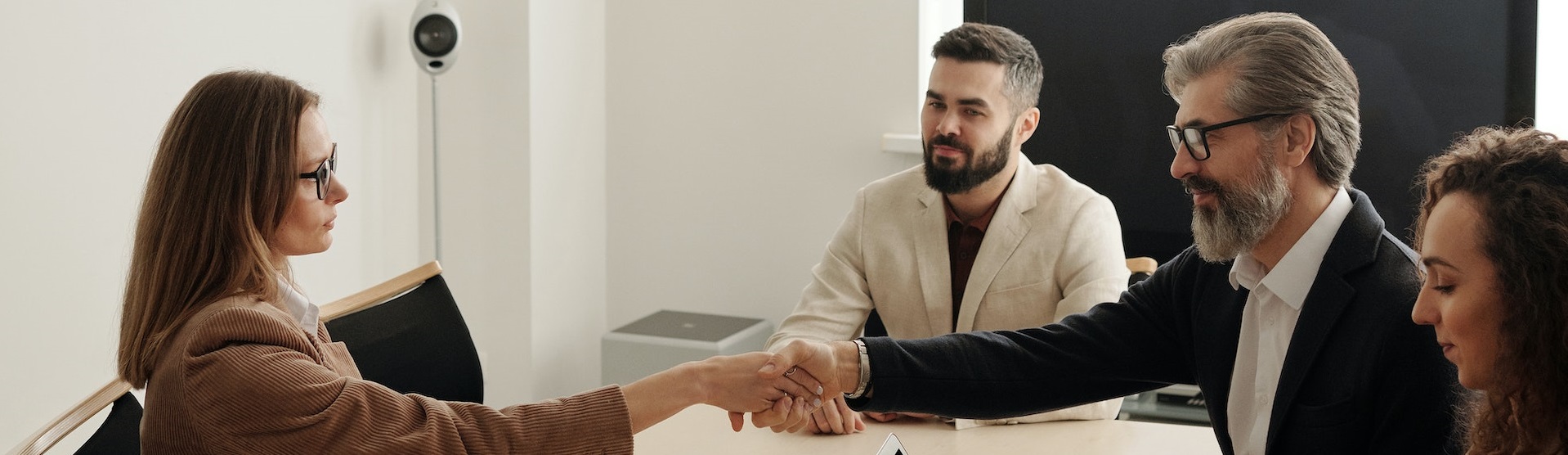 Employer and employees sitting at a table